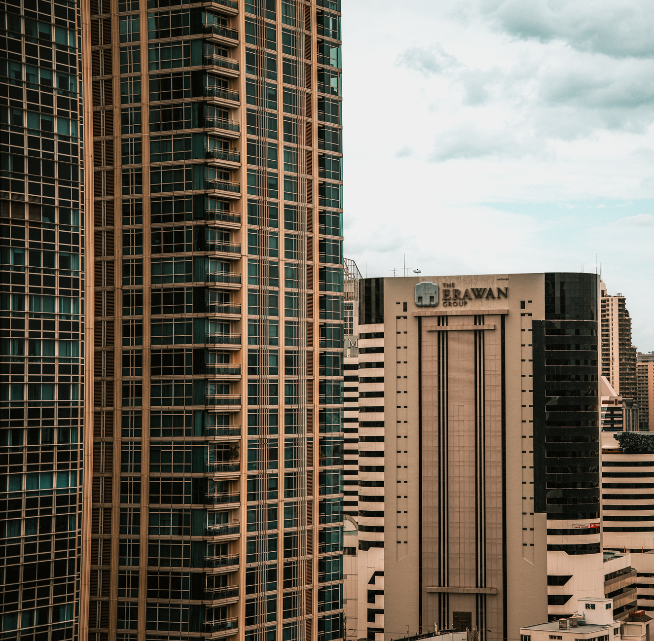 A vibrant view of modern skyscrapers in Bangkok, Thailand, showcasing urban architecture.